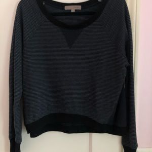 very dark navy blue sweater